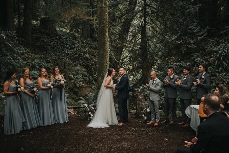 Forest ceremony beneath mossy firs at Cedar Haven Weddings