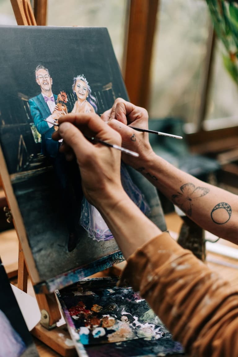 Vancouver Island wedding painter detailing a couple's live canvas