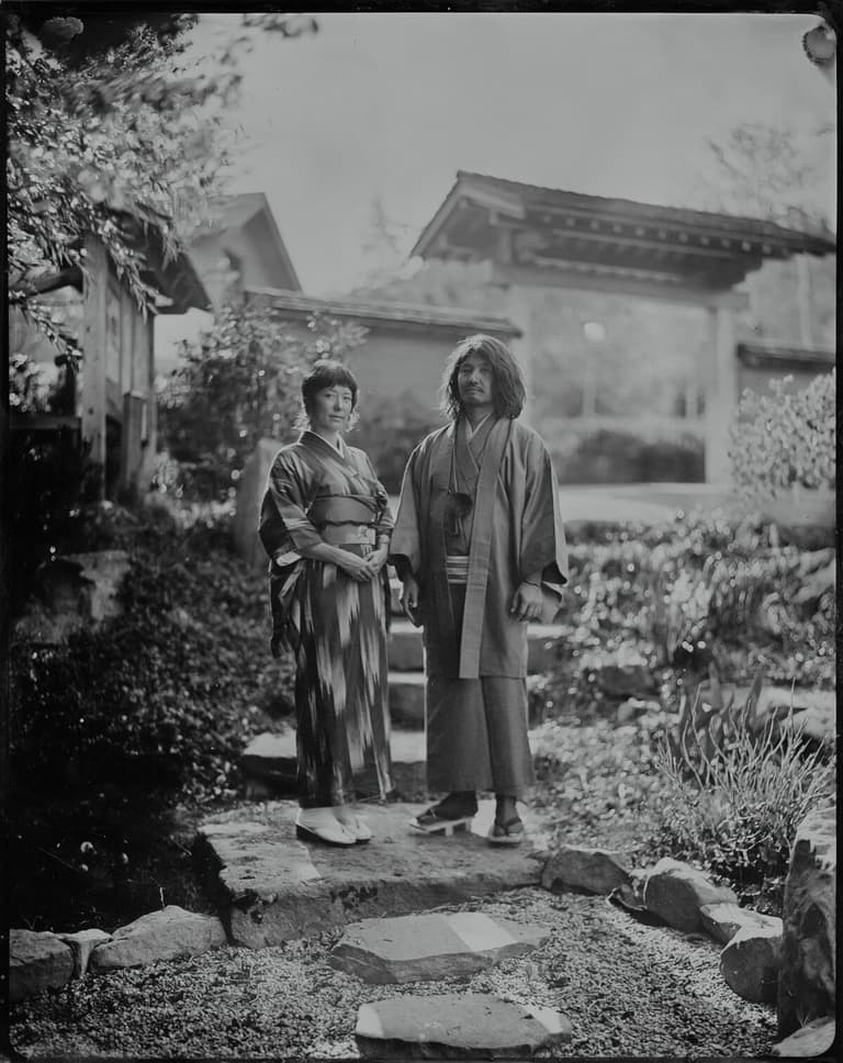 Couple in kimonos posing in a Japanese garden, tintype portrait