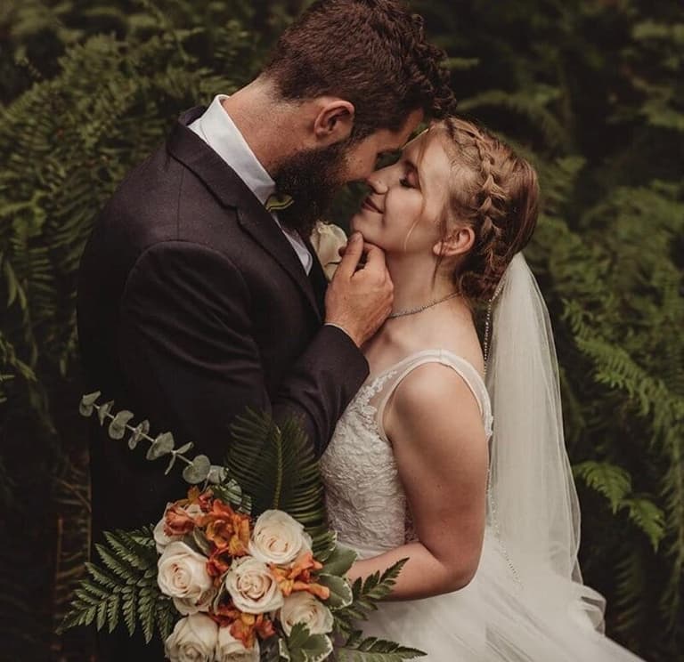Bride's braided updo and soft makeup by Rachel Jannati Artistry
