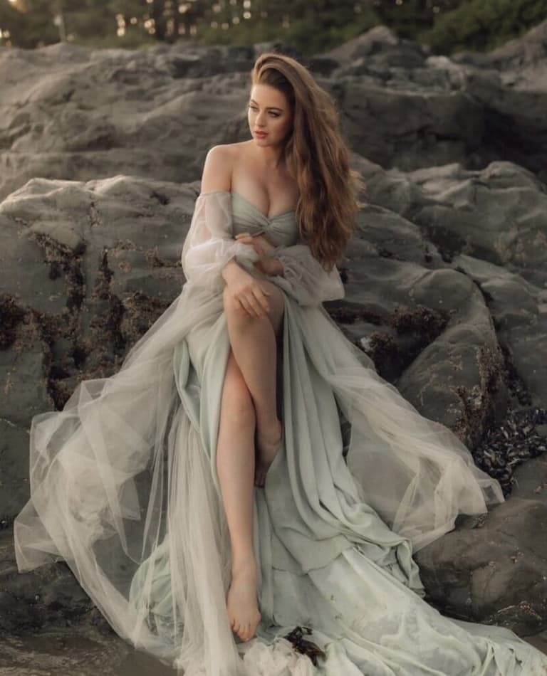 Flowing bridal waves by Salty Dolls on a rocky shore
