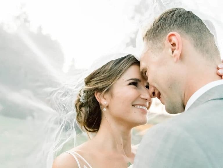 Newlyweds embracing at their wedding in Comox Valley