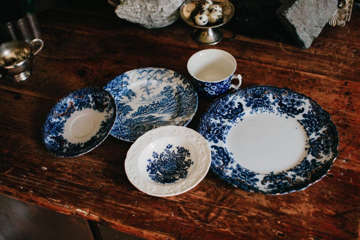 Antique blue and white china laid on weathered wood