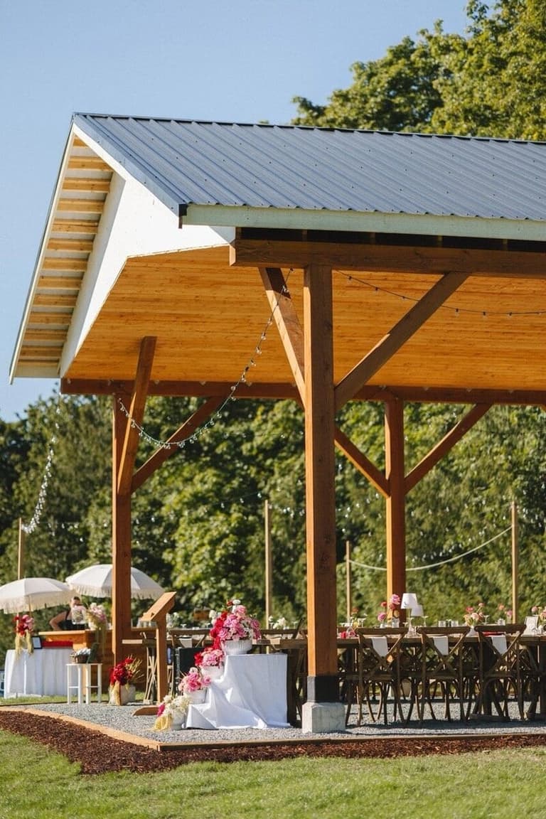 Sunlit timber reception pavilion at Avellana Orchards in Nanaimo