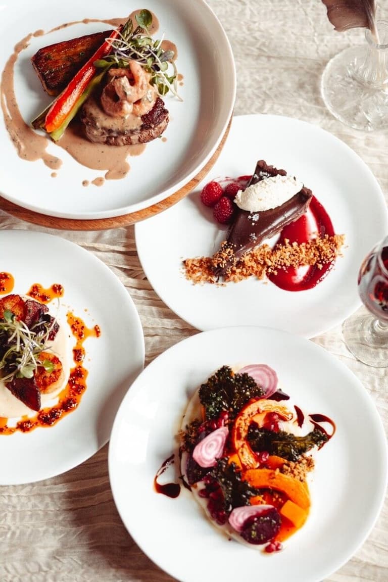 Four artfully plated courses by Salt Spring Catering, seen from above