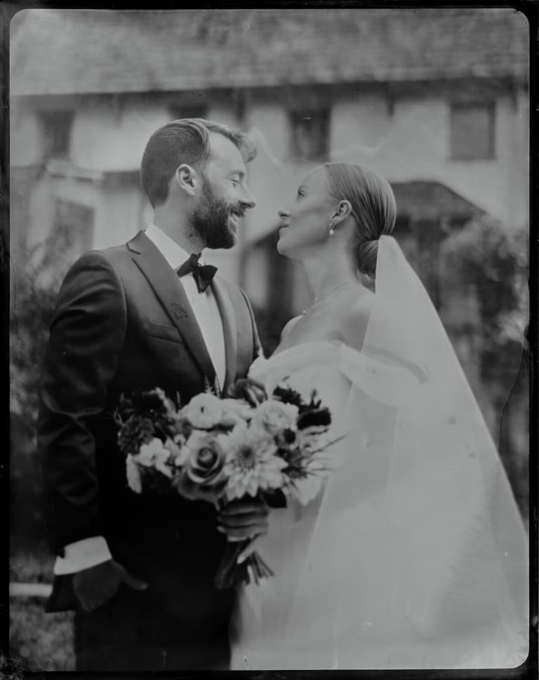 Tintype close-up of a bride and bearded groom facing each other