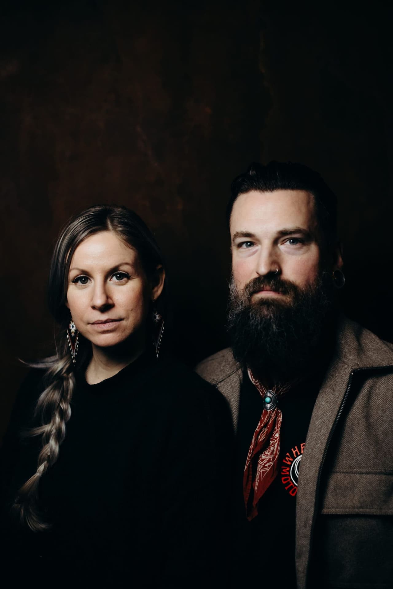 Two people look toward camera in warm side light at Salt Spring Island wedding vendors meetup