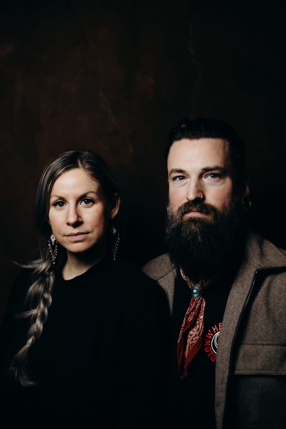 Two people look toward camera in warm side light at Salt Spring Island wedding vendors meetup