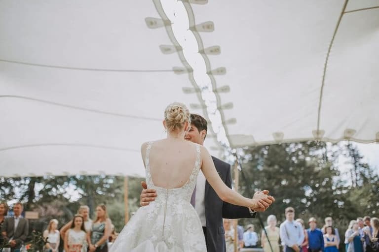First dance beneath a Shady Spaces canopy strung with lights