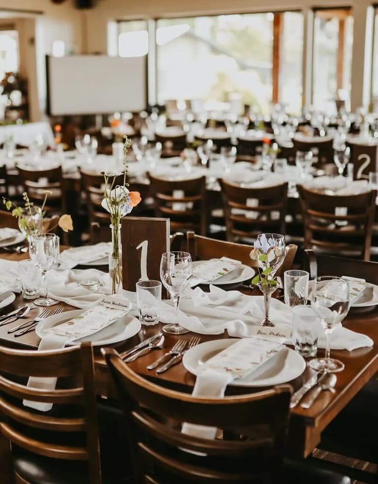 Numbered reception tables set for dinner at Sea Breeze Lodge