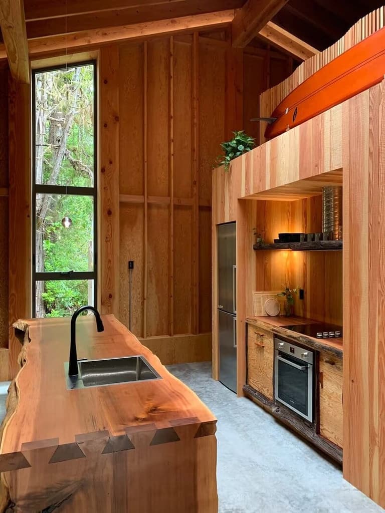 Driftwood Cabin's cedar kitchen with a live-edge counter