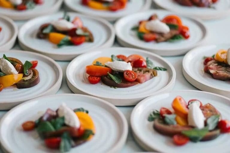 Heirloom tomato appetizer plates by Mensch Kitchen and Catering
