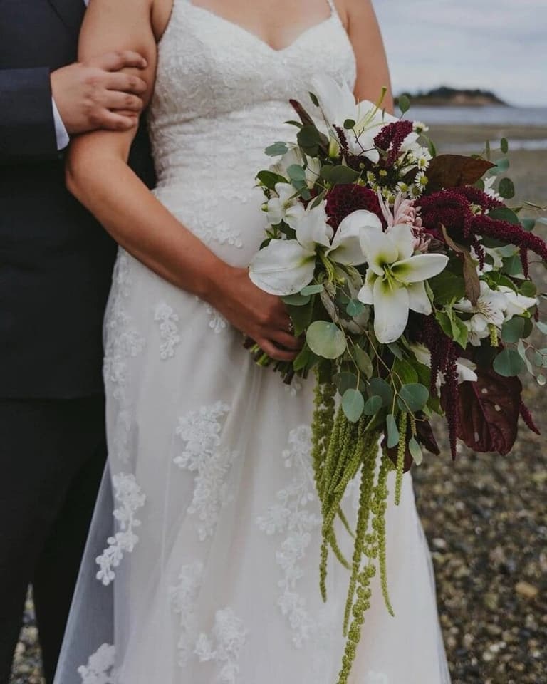 Cascading amaryllis and amaranth bridal bouquet by Roo Floral