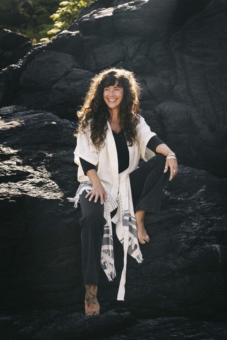 Women posing on rocks into tofino British Columbia