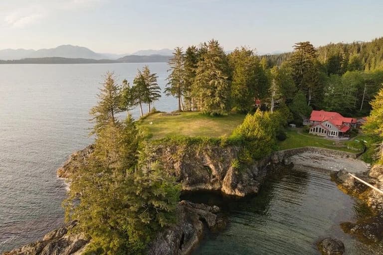 Aerial view of Pacific Sounds Lodge on its forested point